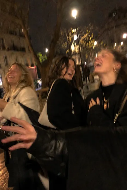 Friends laughing together during an imperfect night-out photo